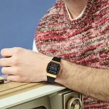 CASIO VINTAGE DIGITAL WATCH IN BLACK AND GOLD A168WEGB-1BVT